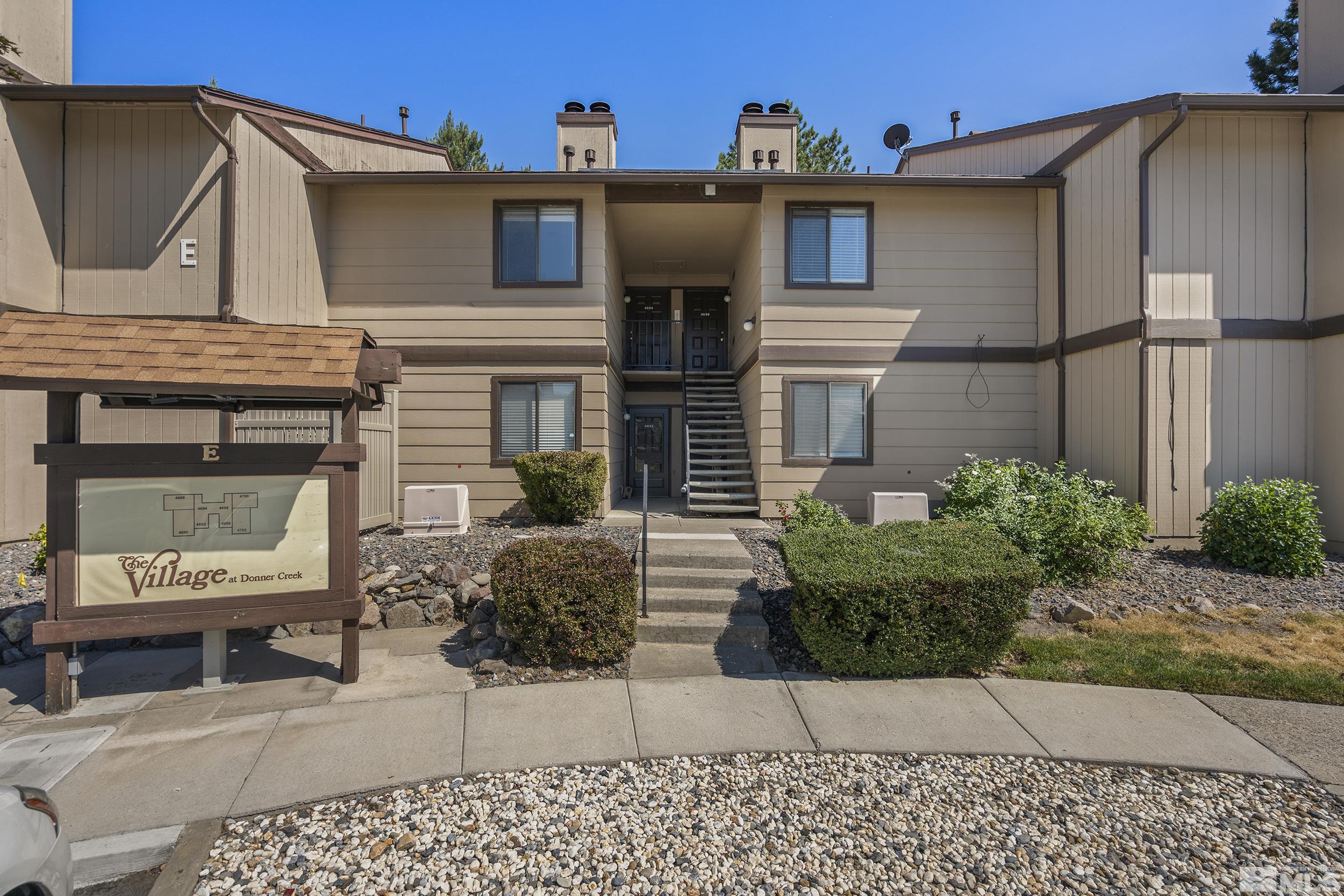4694 Rio Poco Road Reno, NV 89502 - Photo 1 of 19 a view of a house with a bench