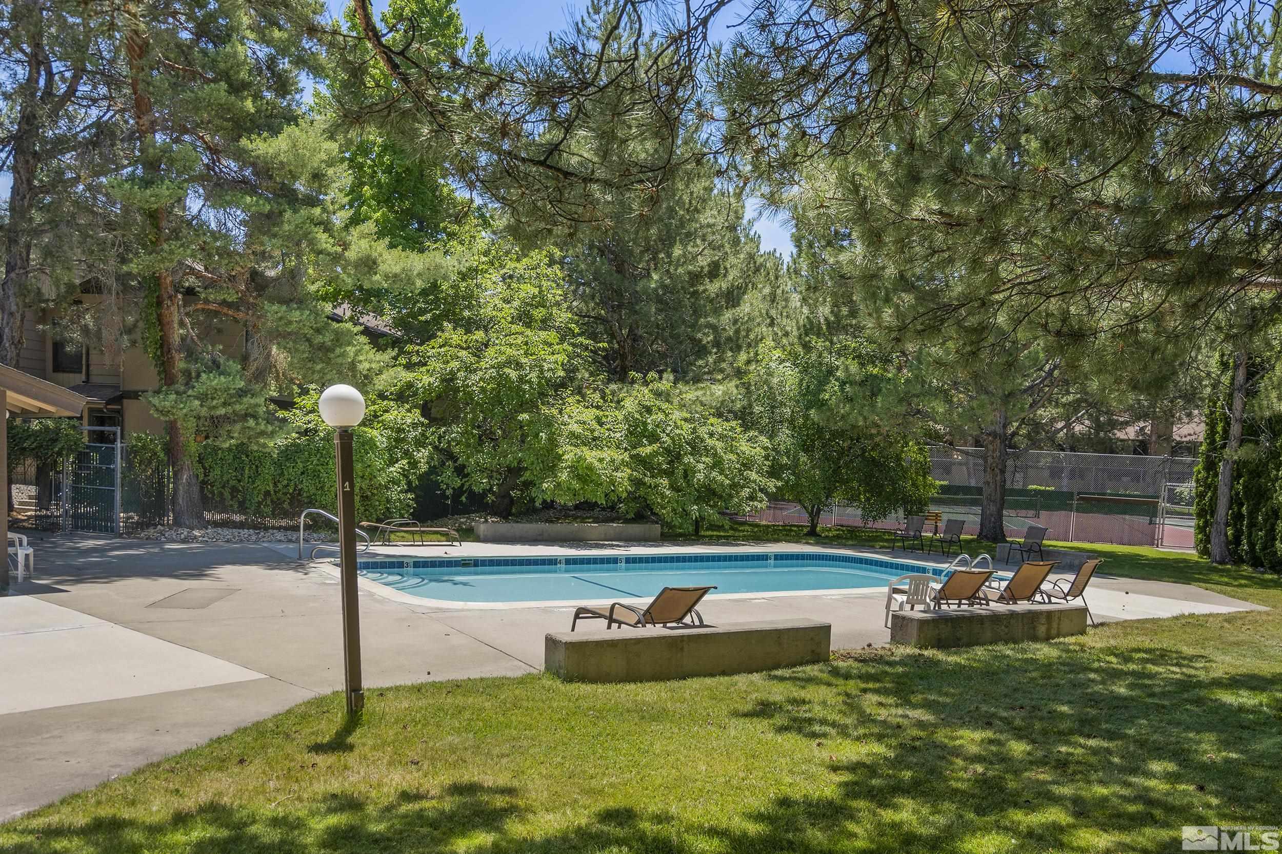 4694 Rio Poco Road Reno, NV 89502 - Photo 17 of 19 a view of a swimming pool with a patio