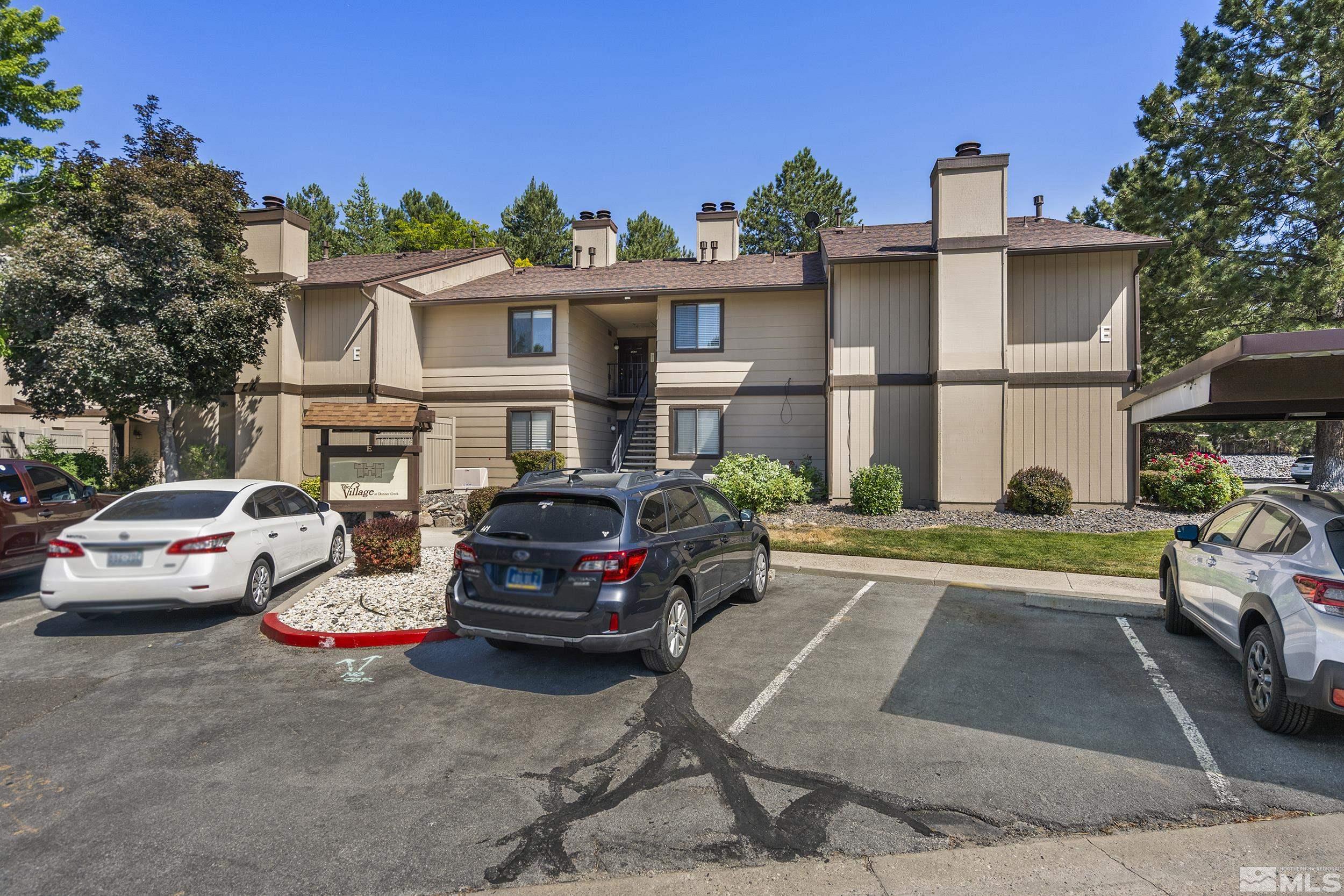 4694 Rio Poco Road Reno, NV 89502 - Photo 19 of 19 a view of a cars park in front of a building