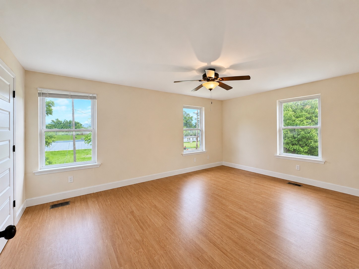 352 Main Street Cerulean, KY 42215 - Photo 23 of 32 an empty room with wooden floor and windows