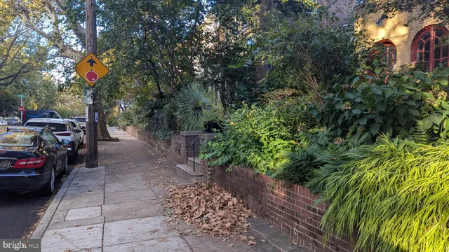 a view of a garage with a car parked in the forest