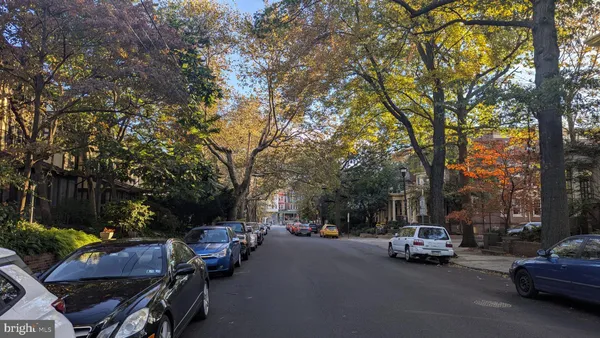 a view of street with parked cars