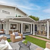 a view of a patio with couches chairs and potted plants