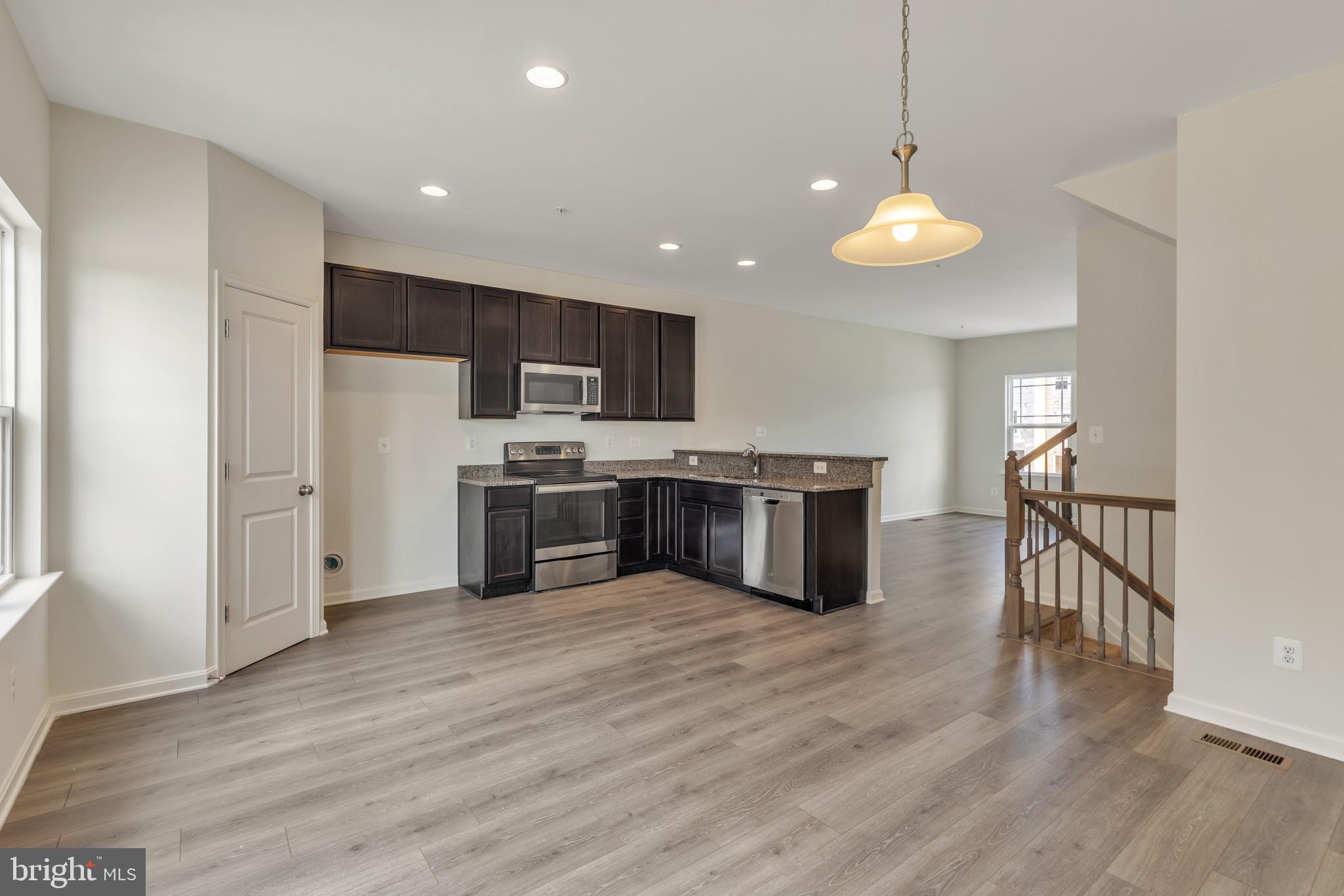 821 Magnolia Ridge Court Joppa, MD 21085 - Photo 12 of 33 a kitchen with stainless steel appliances a refrigerator and a microwave