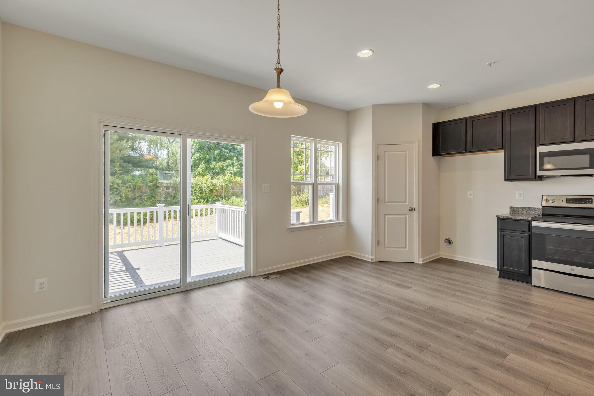 821 Magnolia Ridge Court Joppa, MD 21085 - Photo 13 of 33 a view of empty room with wooden floor and fan