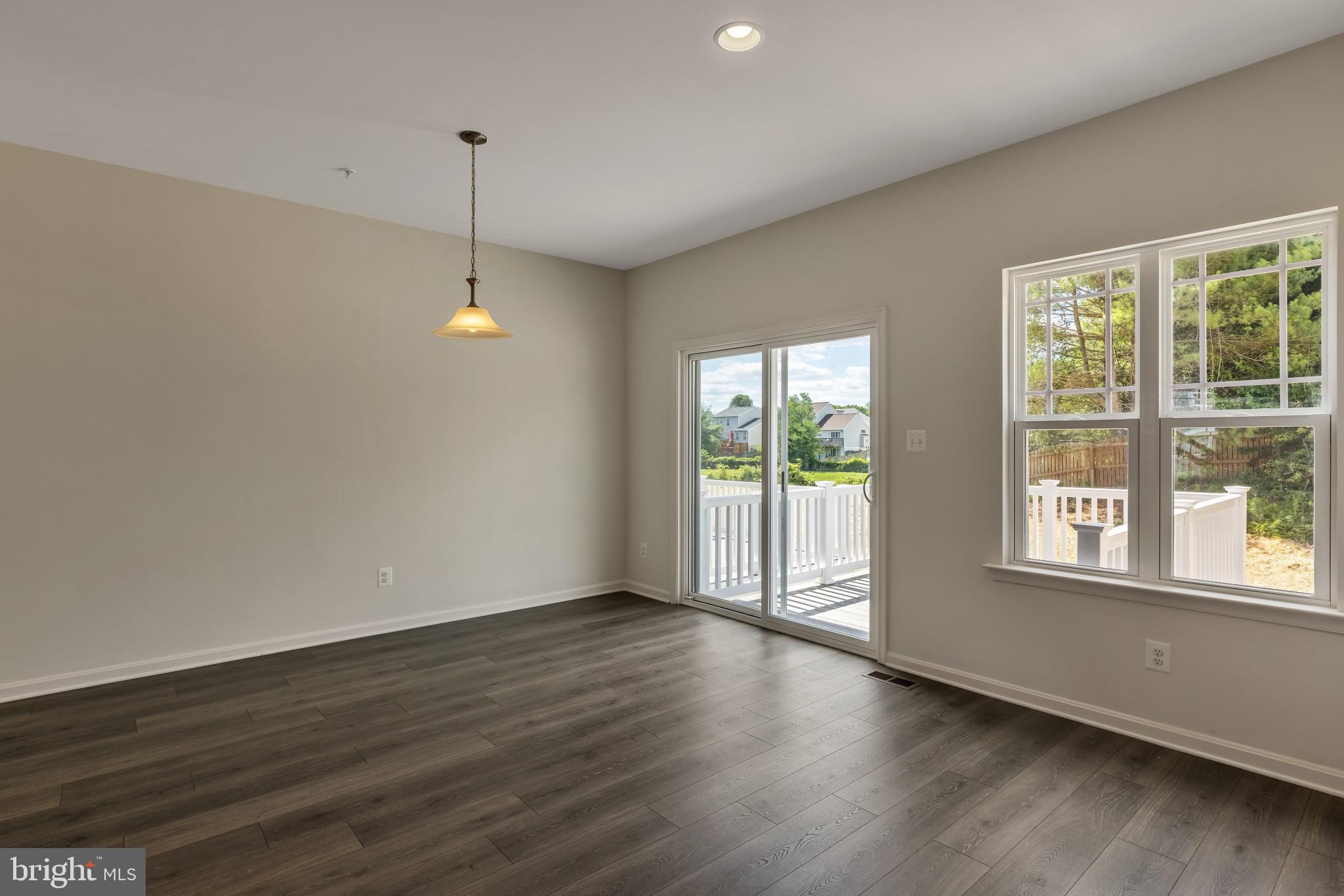 821 Magnolia Ridge Court Joppa, MD 21085 - Photo 16 of 33 a view of an empty room with wooden floor and a window