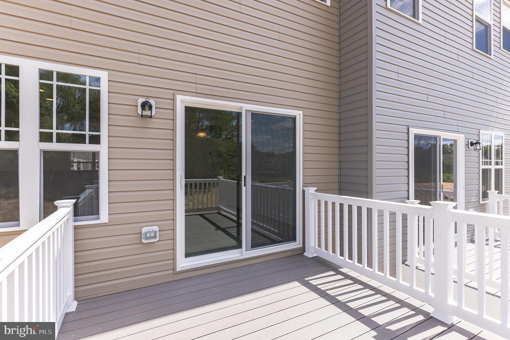 821 Magnolia Ridge Court Joppa, MD 21085 - Photo 19 of 33 a view of a deck with a door and wooden floor