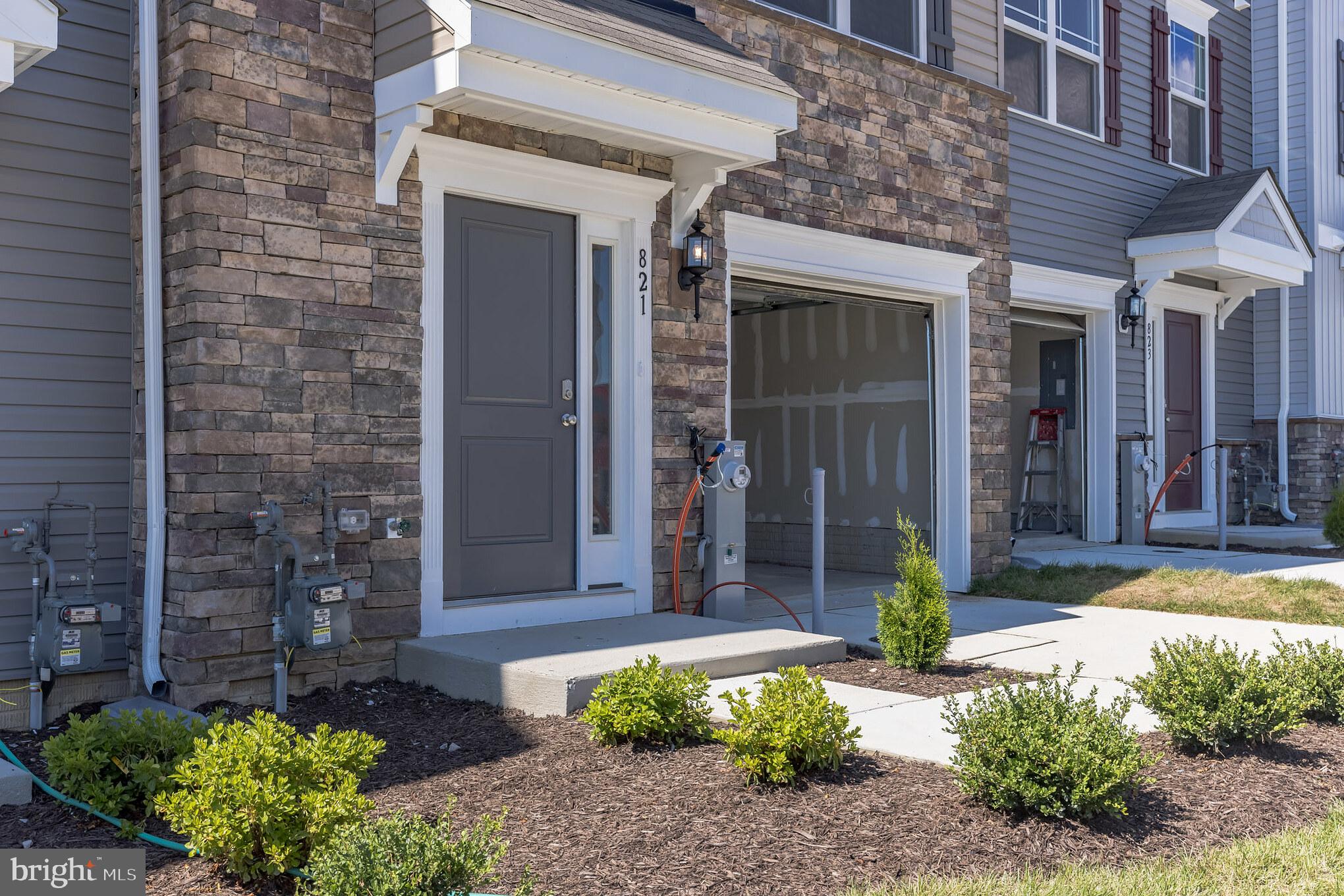 821 Magnolia Ridge Court Joppa, MD 21085 - Photo 2 of 33 a front view of a house with garden