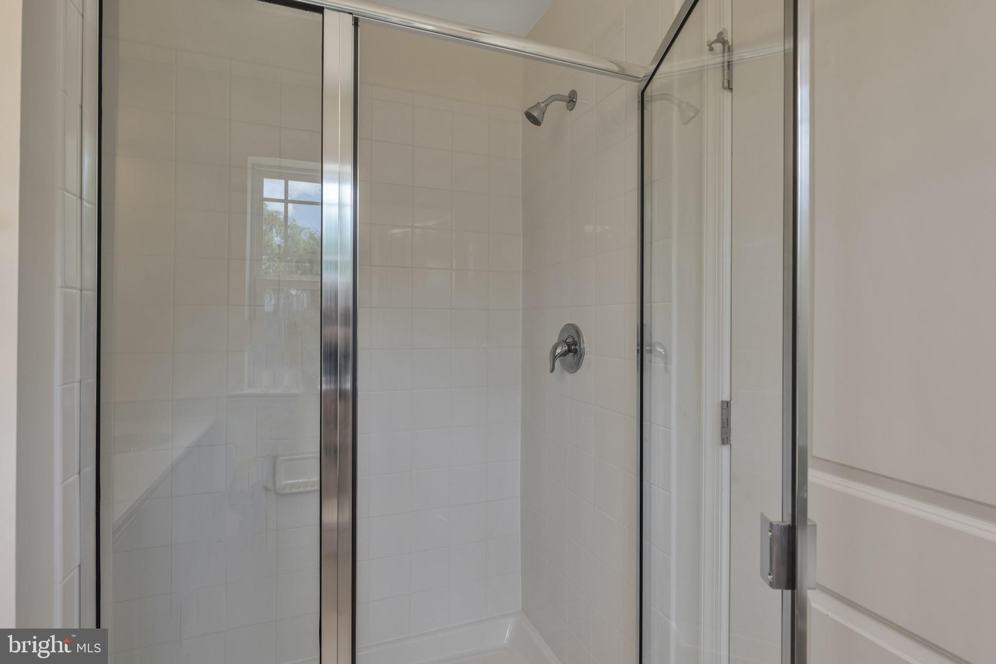 821 Magnolia Ridge Court Joppa, MD 21085 - Photo 23 of 33 a bathroom with a glass shower door