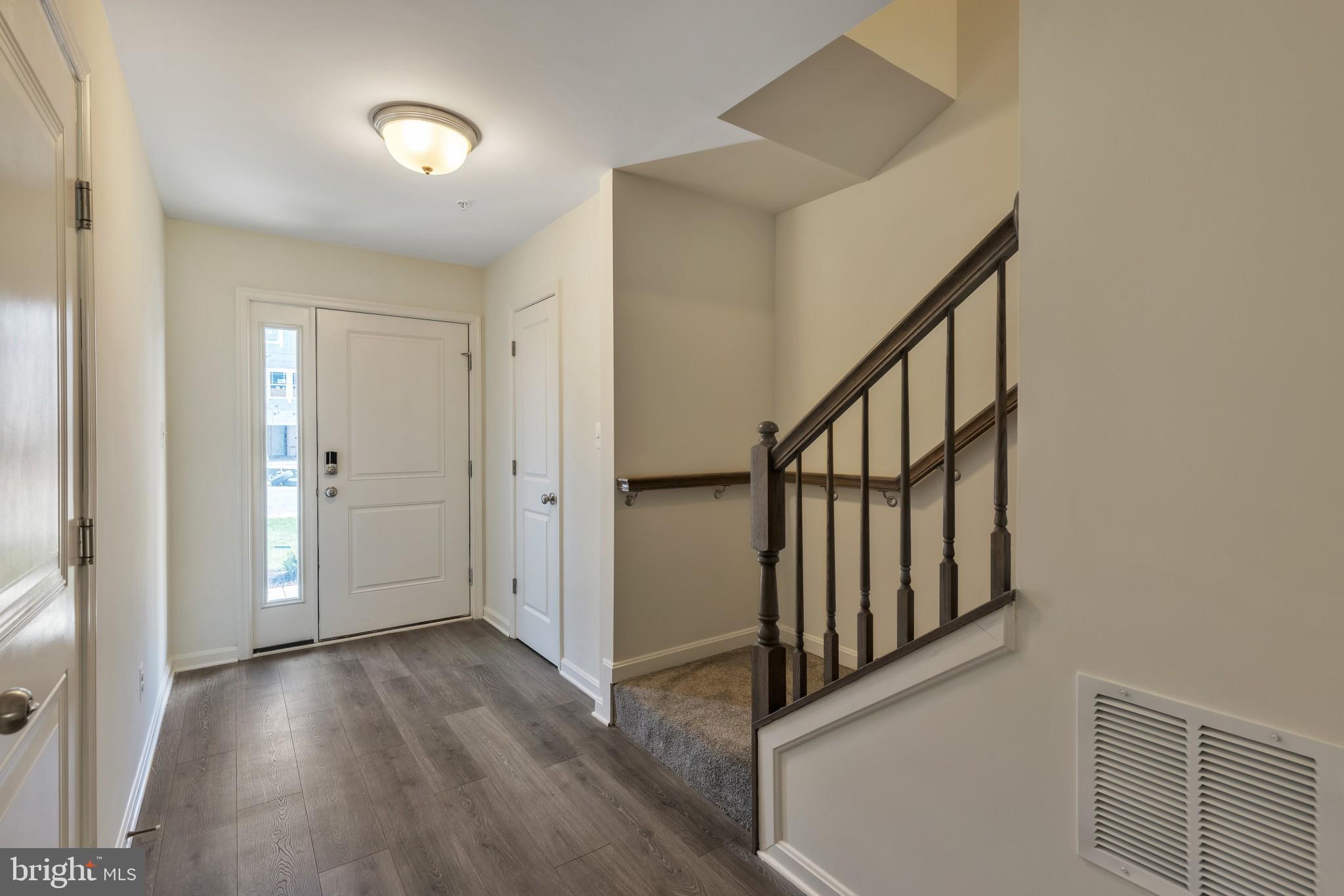 821 Magnolia Ridge Court Joppa, MD 21085 - Photo 6 of 33 a view of an entryway with wooden floor and stairs