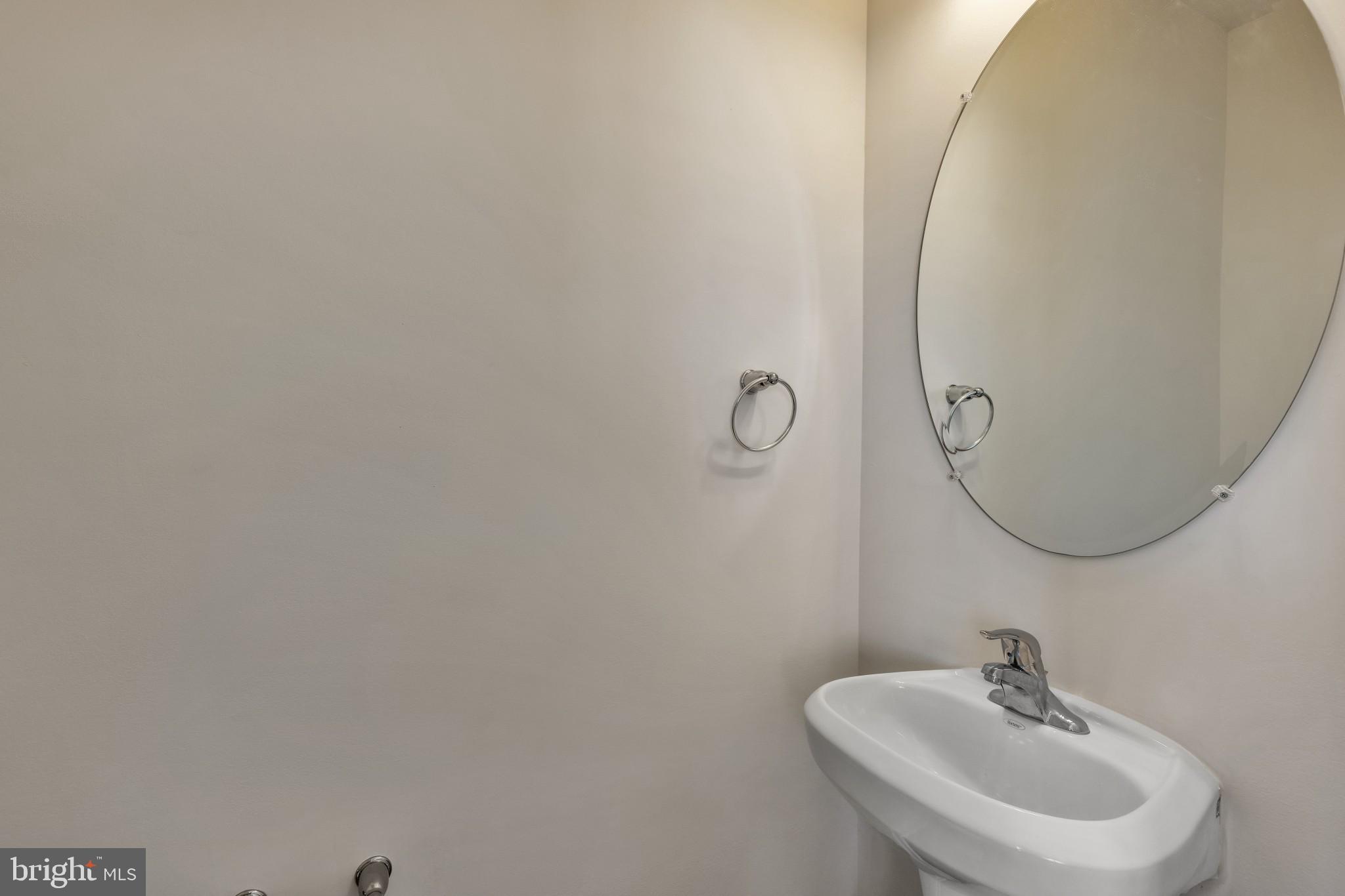 821 Magnolia Ridge Court Joppa, MD 21085 - Photo 9 of 33 a bathroom with a sink and mirror