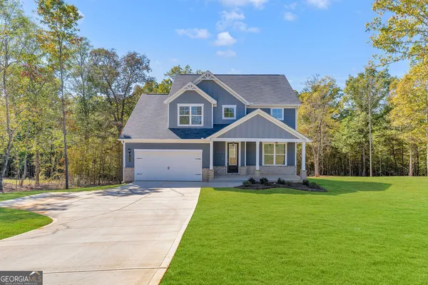 a front view of a house with yard