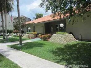 a view of a swimming pool and outside seating area
