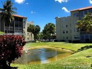 a house with swimming pool in front of it