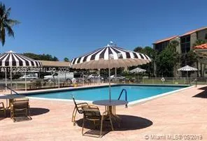 a sign broad in front of flowers