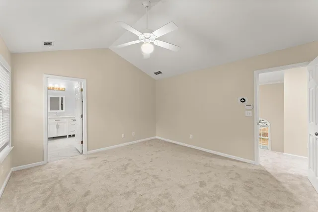 a bathroom with a granite countertop sink mirror and a bathtub