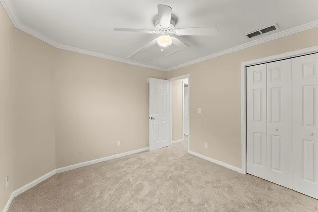 a bathroom with a sink a toilet and shower curtain