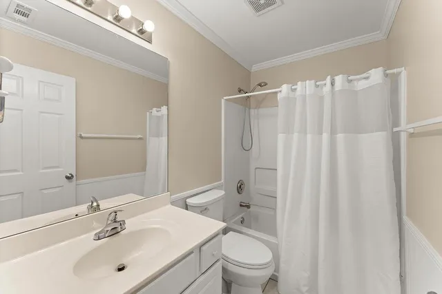 an empty room with a fireplace and stairs