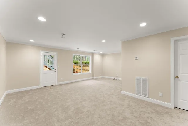 a view of room with a ceiling fan and hardwood floor