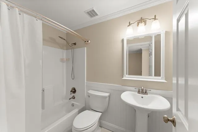 a view of a hallway with staircase