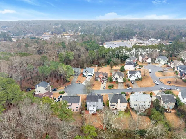a view of multiple houses with a street