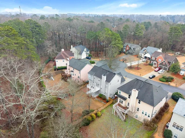 an aerial view of houses with outdoor space