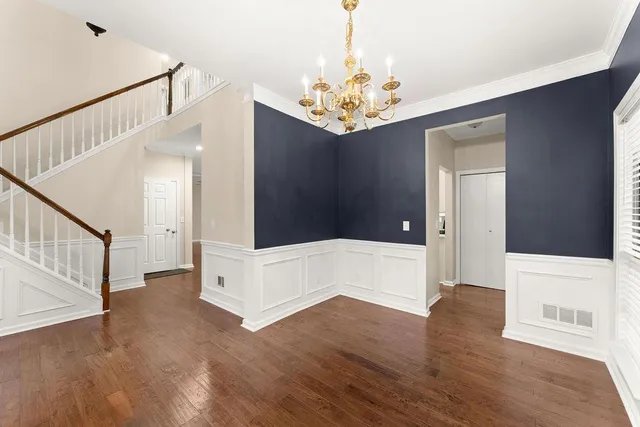 a view of an entryway with chandelier