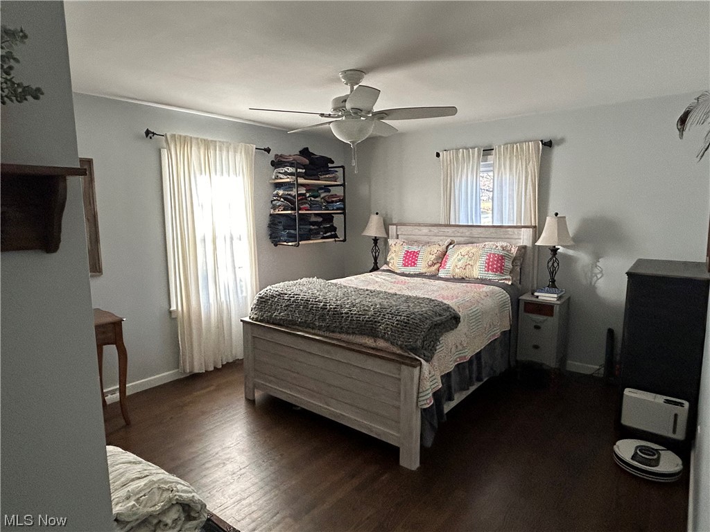 1312 Aberagg Road Atwater, OH 44201 - Photo 14 of 23 Master Bedroom featuring multiple windows, dark hardwood / wood-style floors, and ceiling fan