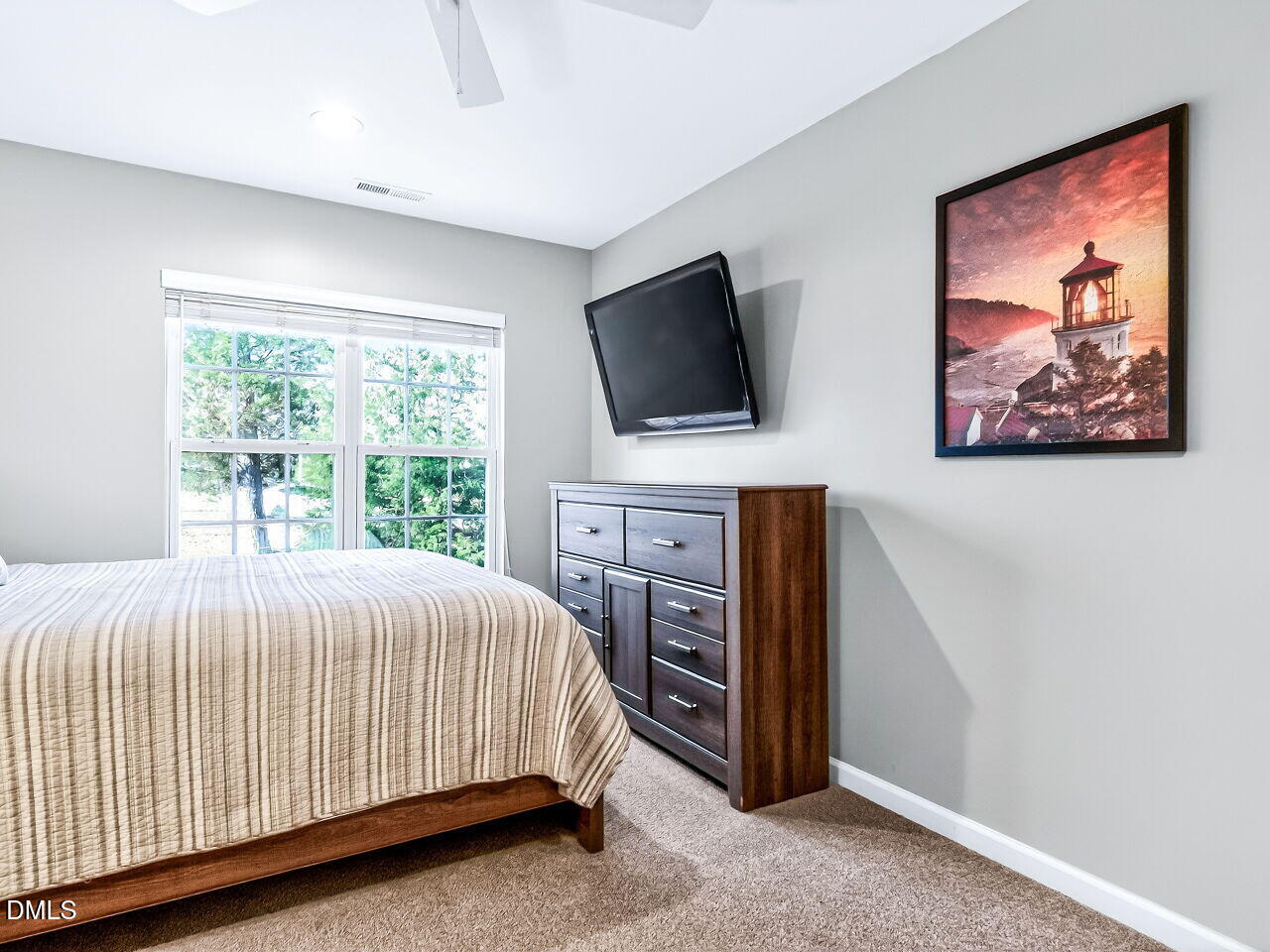422 Intern Way Durham, NC 27713 - Photo 29 of 33 a bedroom with a bed and a flat screen tv