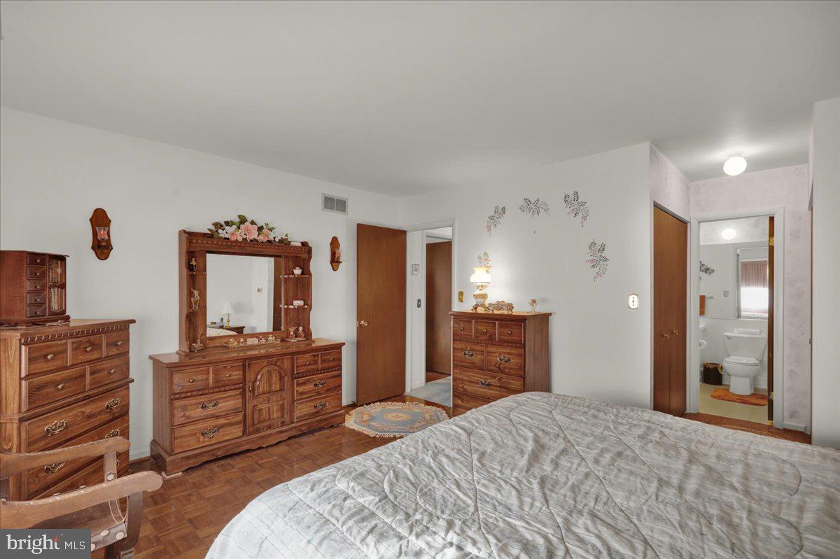 12 Muirfield Drive Reading, PA 19607 - Photo 12 of 18 a bedroom with a bed and a dresser