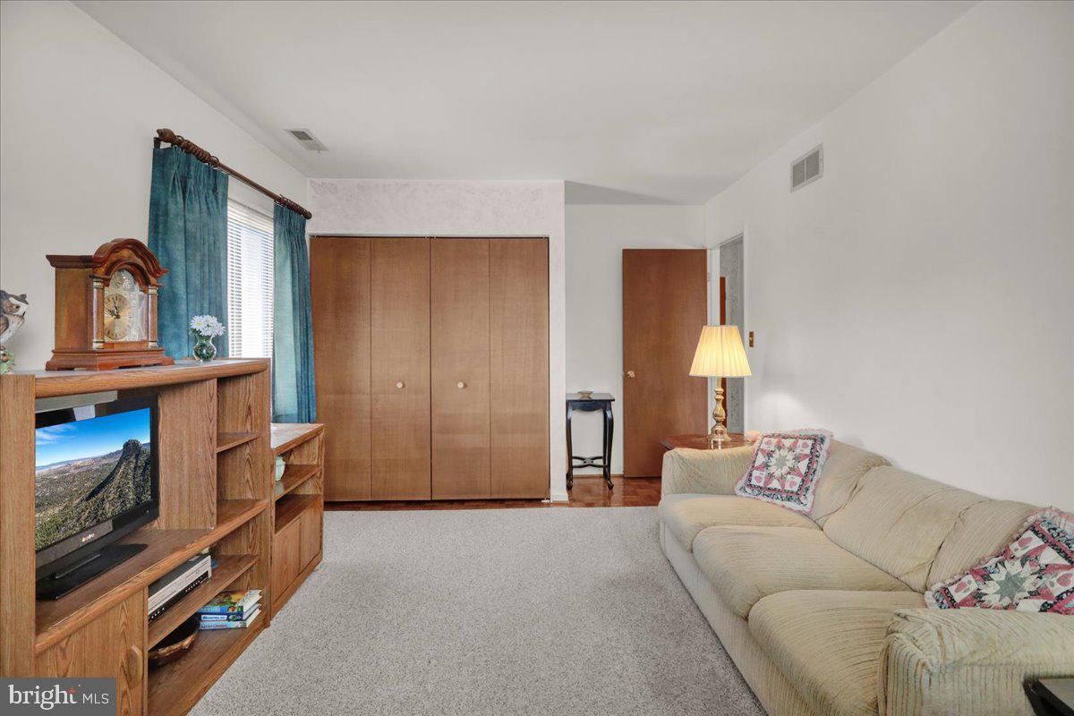 12 Muirfield Drive Reading, PA 19607 - Photo 15 of 18 a bedroom with furniture and a lamp