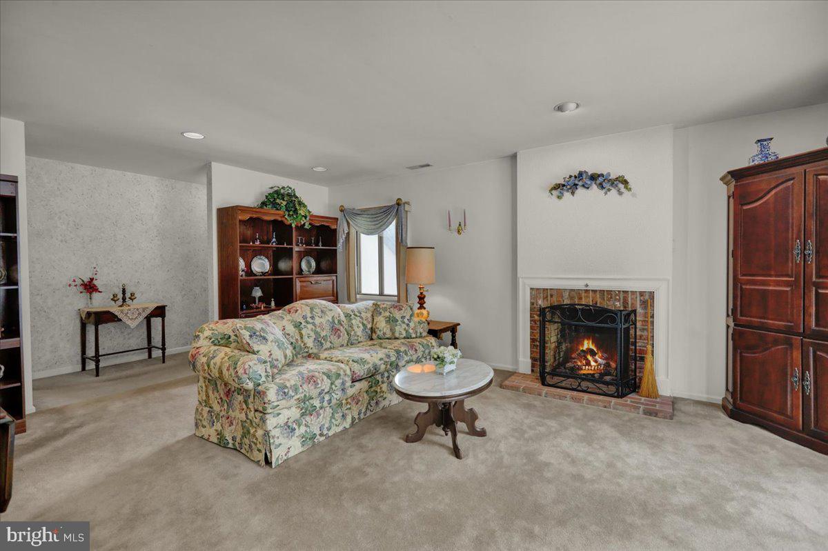 12 Muirfield Drive Reading, PA 19607 - Photo 4 of 18 a living room with furniture and a fireplace