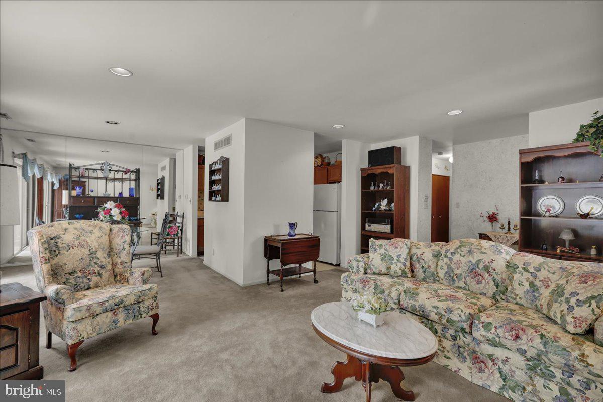 12 Muirfield Drive Reading, PA 19607 - Photo 6 of 18 a living room with furniture and a dining table with kitchen view