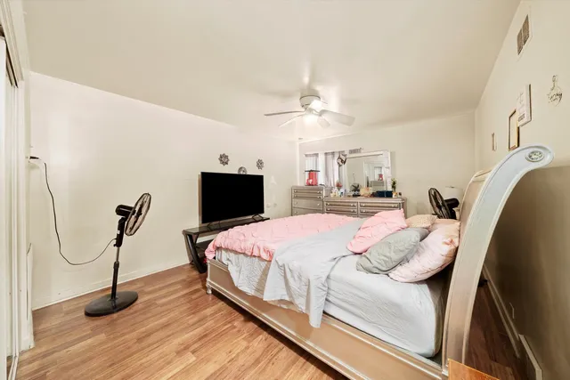 a view of a house with a tree