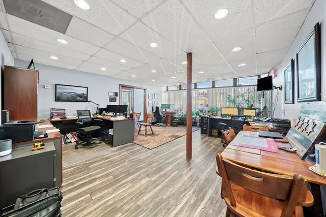 a living room with lots of furniture and a flat screen tv