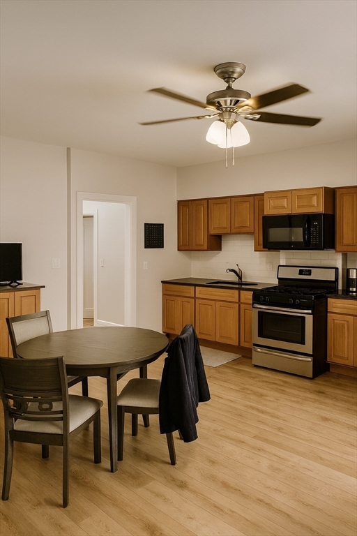 16 Linley Terrace, Unit 1 Boston, MA 02127 - Photo 2 of 7 a view of a dining room with furniture and wooden floor