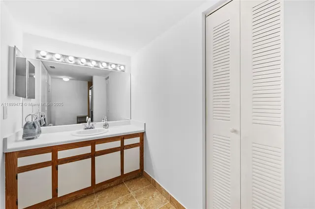a bathroom with a double vanity sink and a mirror