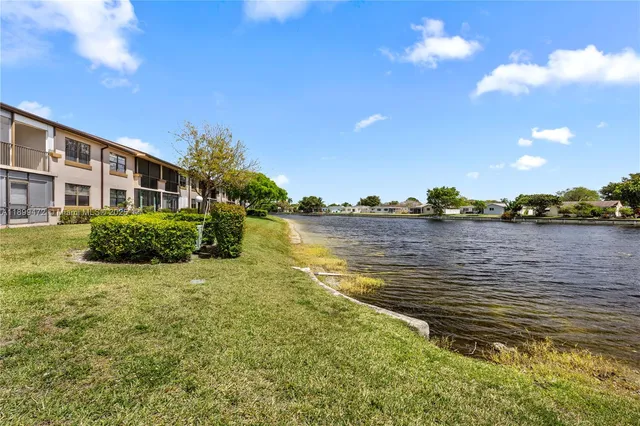 a view of a lake with a house in the background