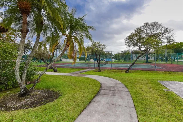 a view of a park with swings and slides