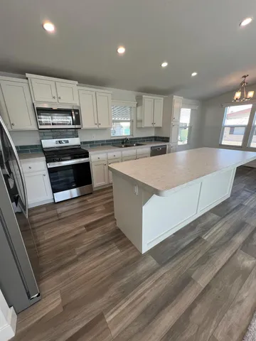 a view of a hallway to rooms