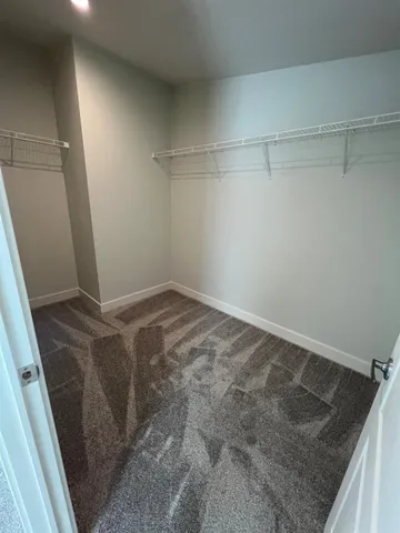 a bathroom with a granite countertop sink toilet a mirror and bathtub