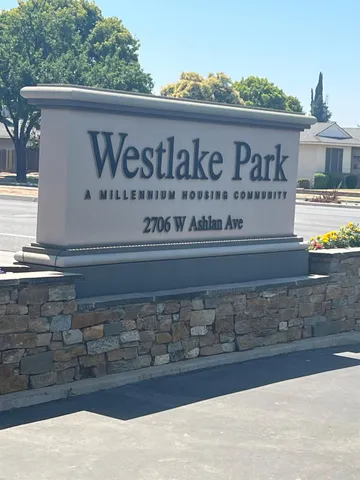 a view of a lake with a house in the background