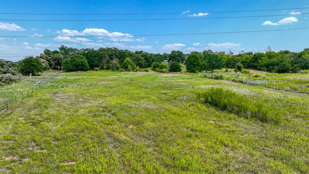 550 New Highland Road Springtown, TX 76082 - Photo 6 of 15 View of yard with a rural view