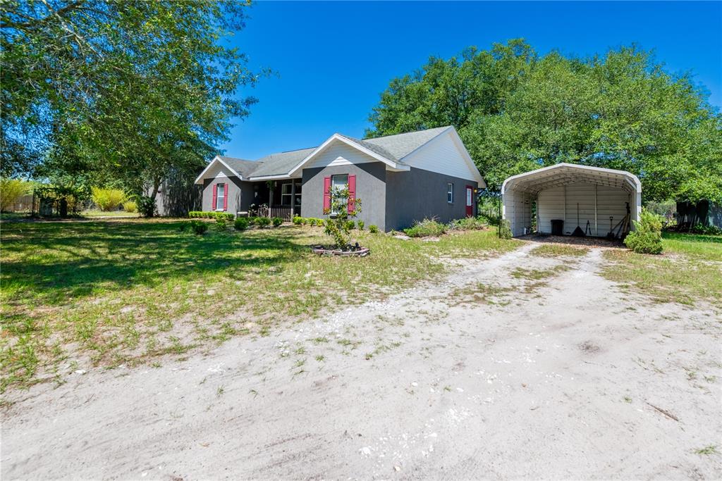 1750 Southwest 15th Street Bell, FL 32619 - Photo 2 of 34 a front view of a house with a yard