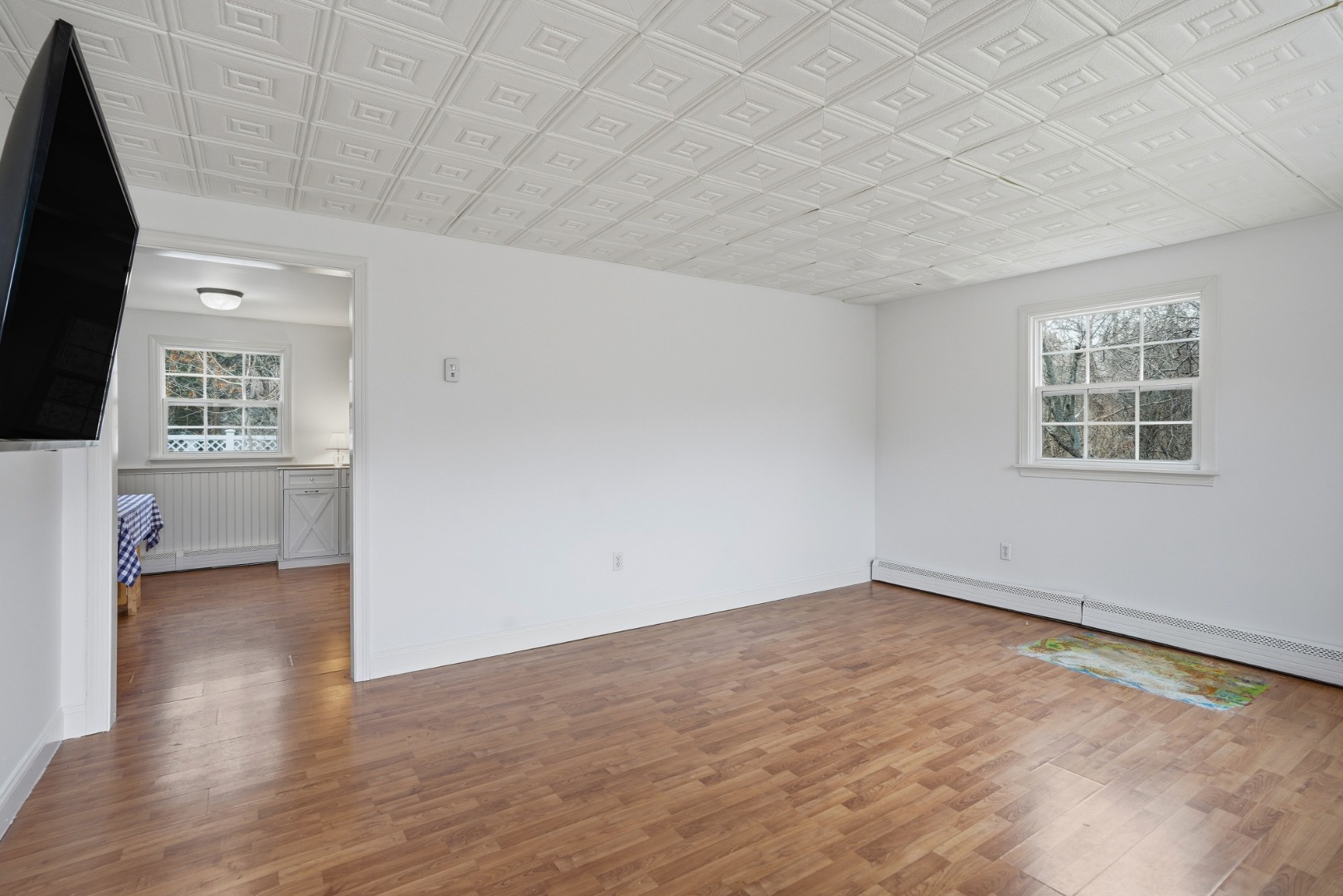 67 12th Street Edgartown, MA 02539 - Photo 11 of 26 an empty room with windows