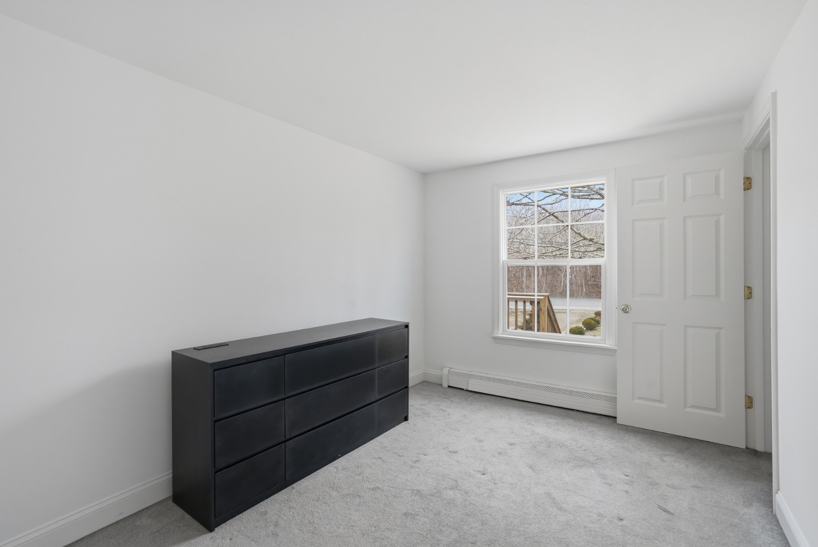 67 12th Street Edgartown, MA 02539 - Photo 12 of 26 an empty room with windows