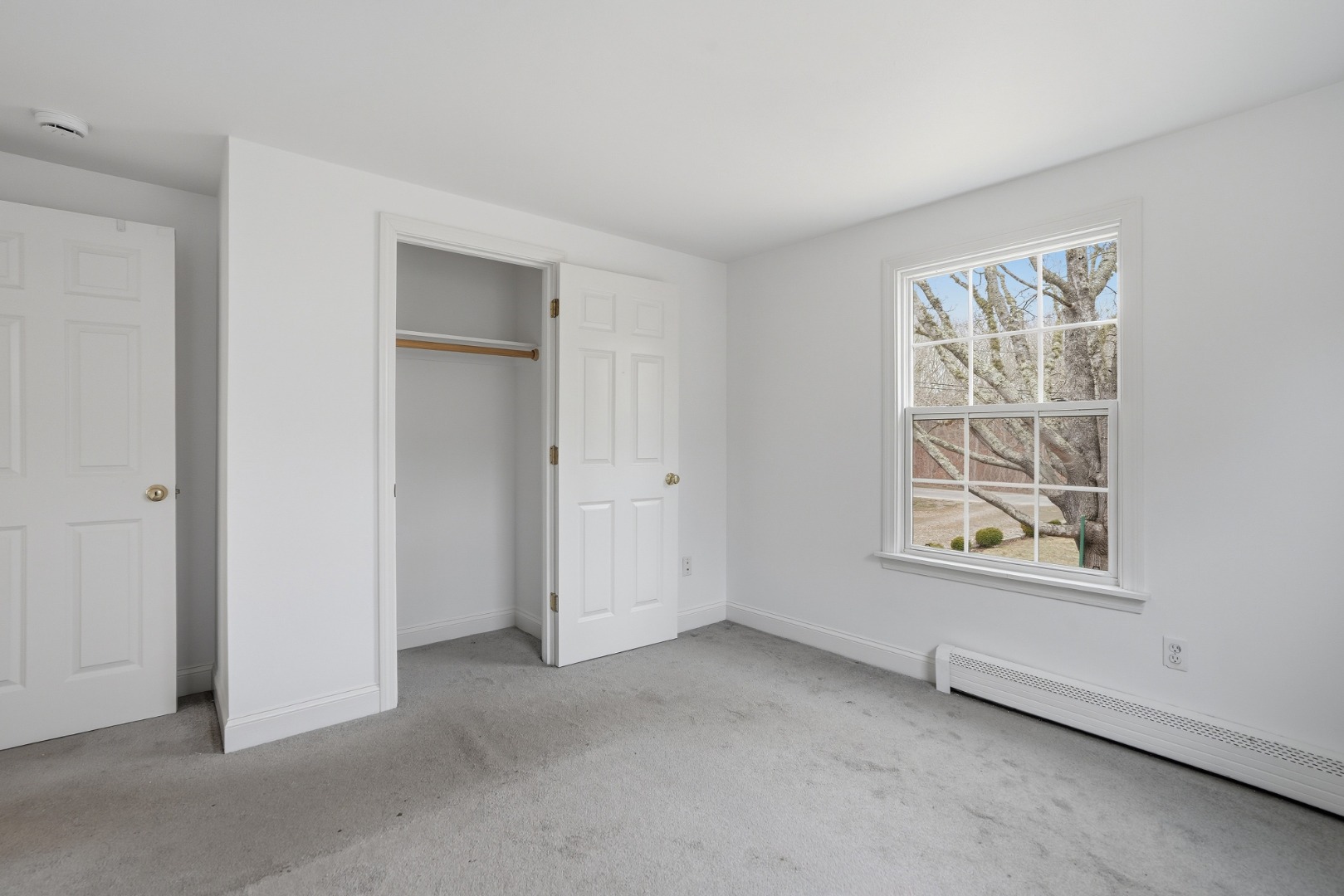 67 12th Street Edgartown, MA 02539 - Photo 13 of 26 an empty room with windows and closet