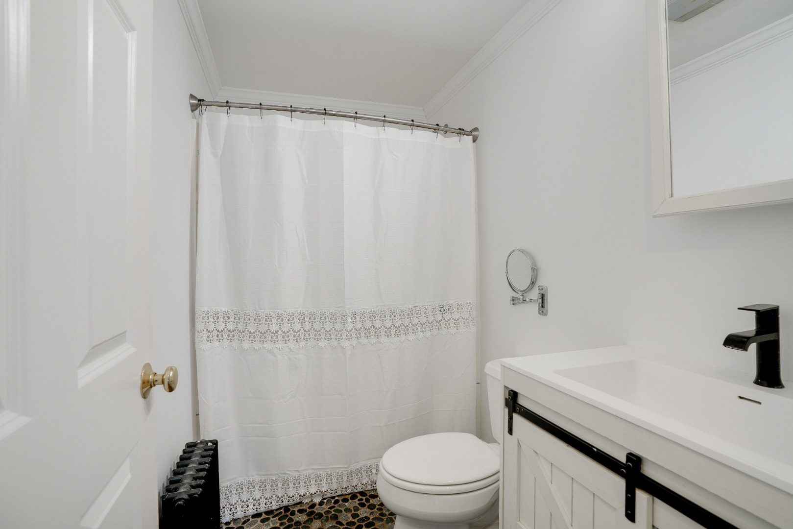 67 12th Street Edgartown, MA 02539 - Photo 17 of 26 a bathroom with a sink a toilet and shower