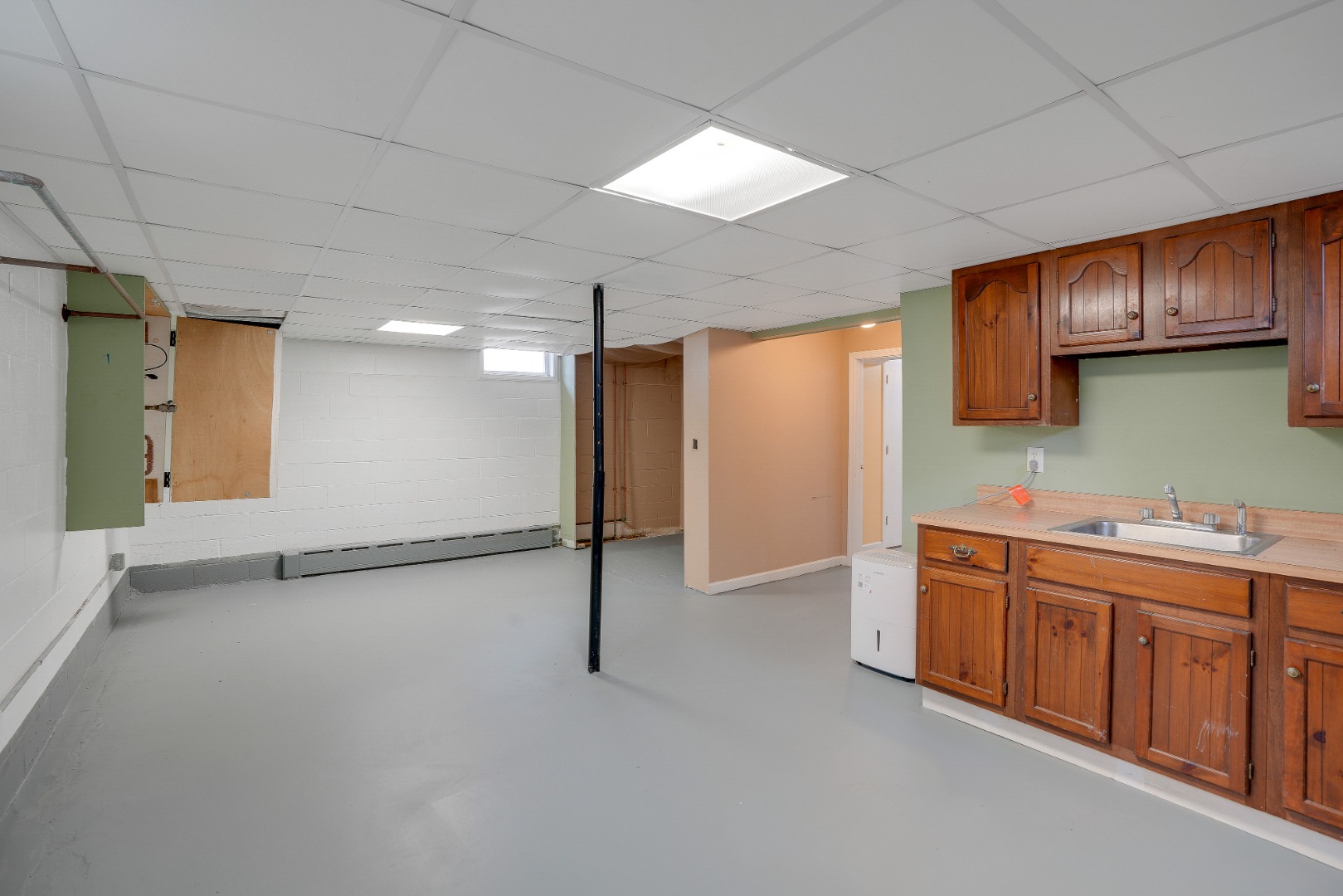 67 12th Street Edgartown, MA 02539 - Photo 23 of 26 a view of a kitchen with stainless steel appliances granite countertop a refrigerator and a sink