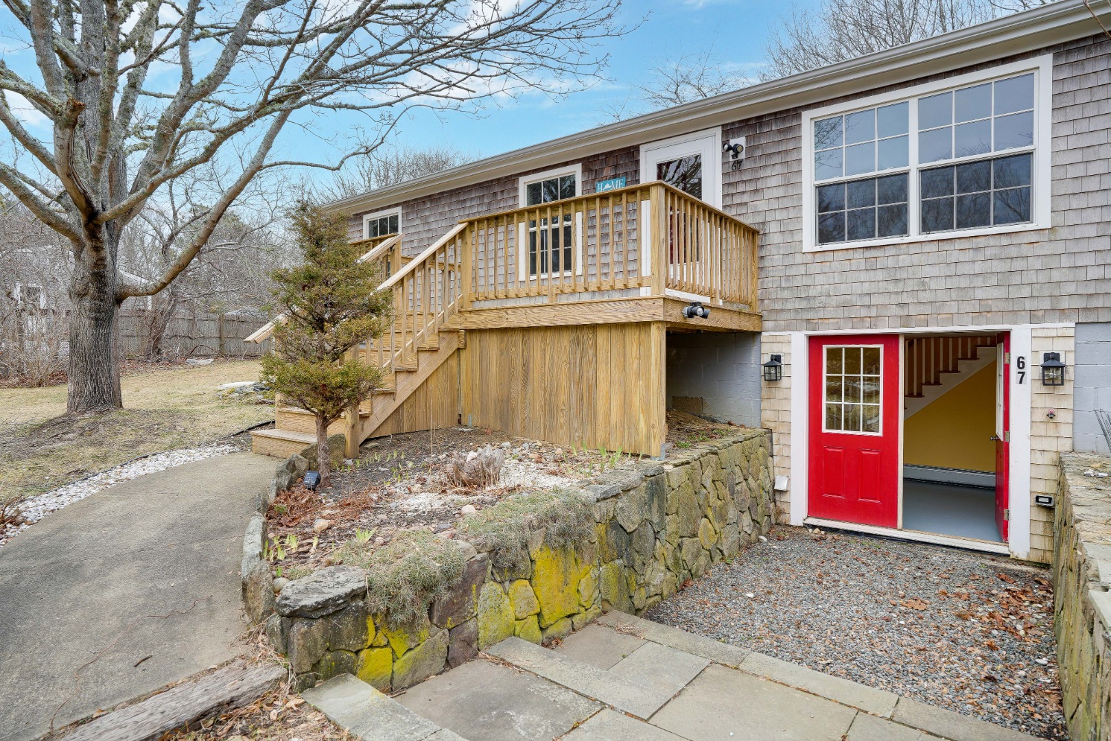 67 12th Street Edgartown, MA 02539 - Photo 3 of 26 a front view of a house with parking area